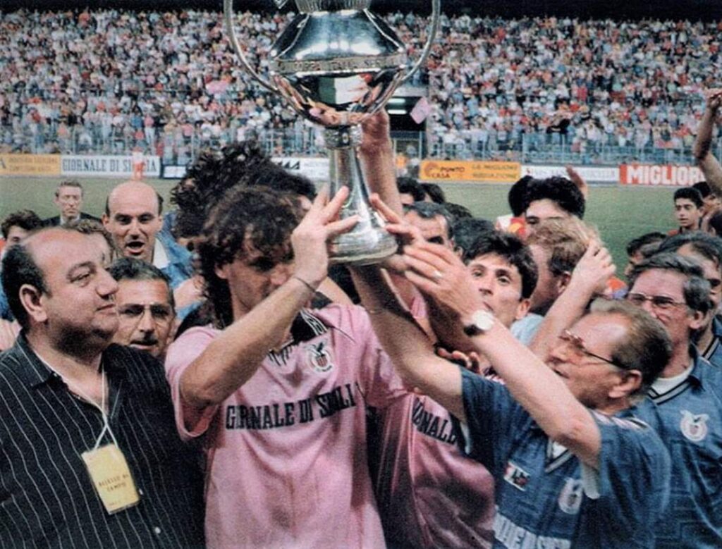 Roberto Biffi lifts the Coppa Italia trophy above his head for Palermo